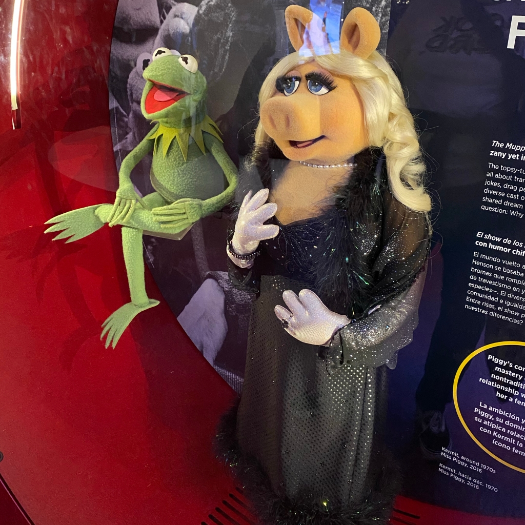 Kermit the Frog and Miss Piggy, wearing a fabulous black gown and stole, as seen at the Smithsonian National Museum of American History.